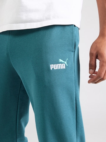 PUMA Tapered Urheiluhousut 'ESS No. 1' värissä vihreä