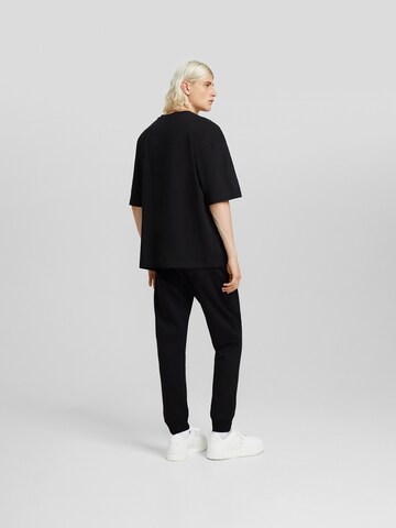 Bershka Tapered Hose in Schwarz