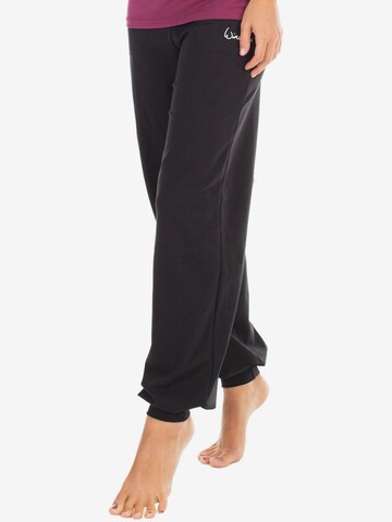 Winshape Tapered Workout Pants 'WH12' in Black: front