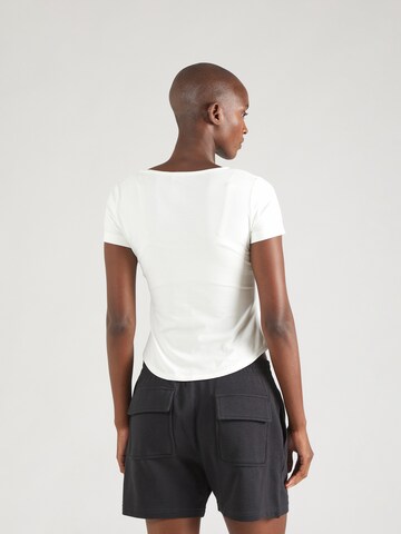 Reebok Performance shirt in Beige