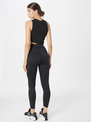 Reebok Skinny Παντελόνι φόρμας 'Running Vector' σε μαύρο