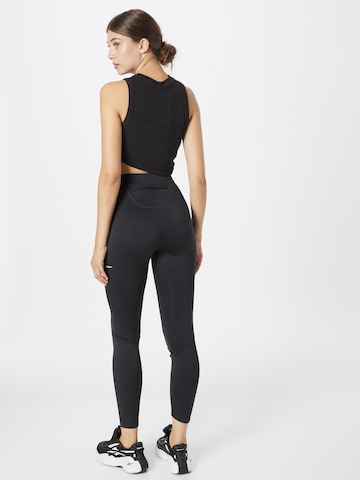 Skinny Pantaloni sportivi 'Running Vector' di Reebok in nero