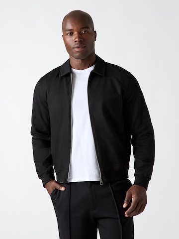 GUESS - Sudadera con cremallera en negro: frente