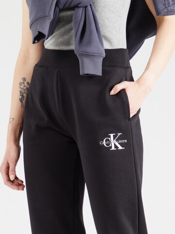 Tapered Pantaloni de la Calvin Klein Jeans pe negru