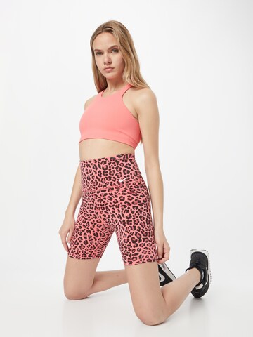 NIKE Skinny Spodnie sportowe w kolorze pomarańczowy