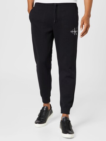 Calvin Klein Jeans Tapered Trousers in Black: front