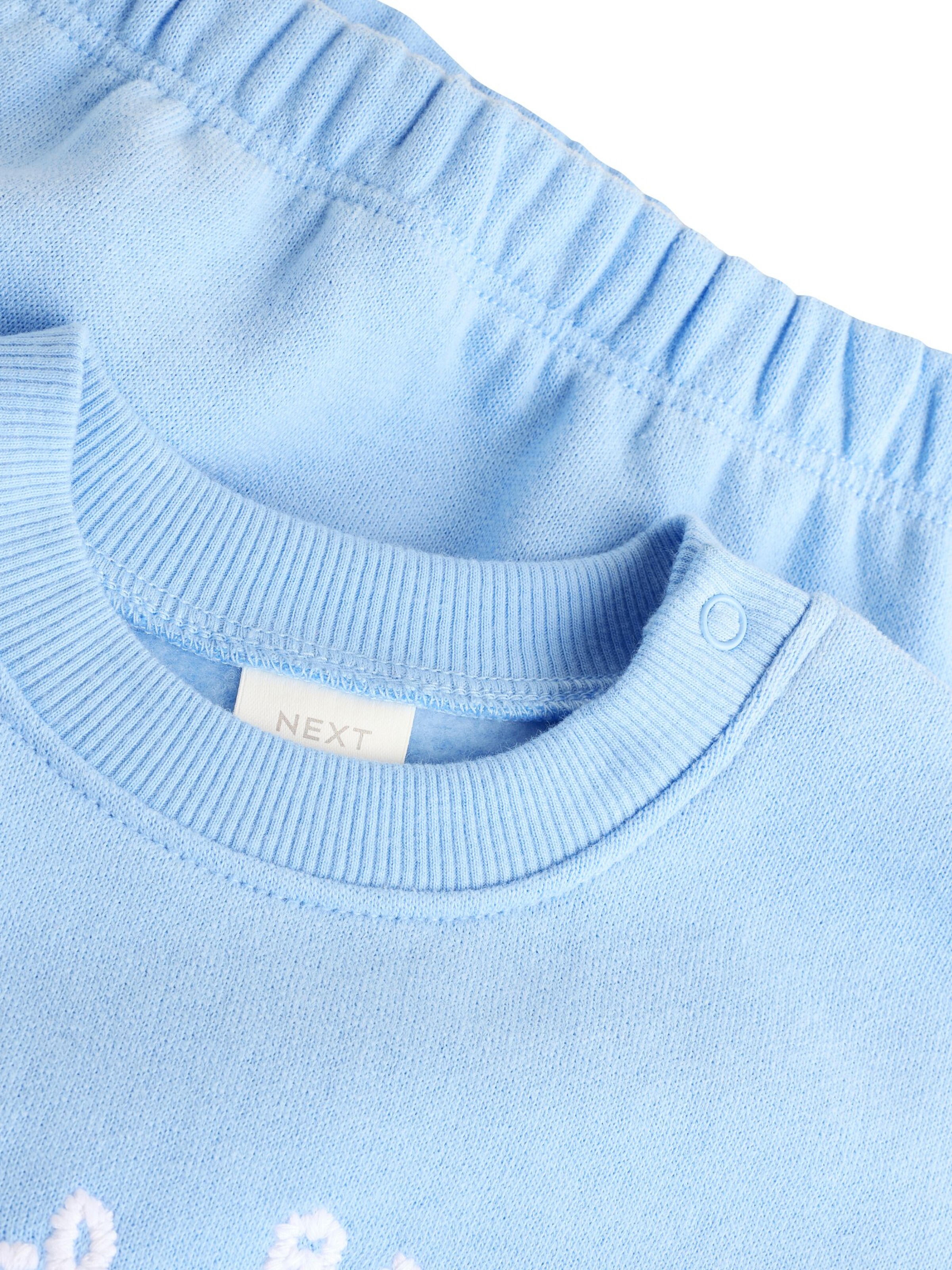 Next Träningsoverall i blå