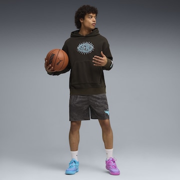 PUMA Sweatshirt 'Melo x Hive' in Schwarz