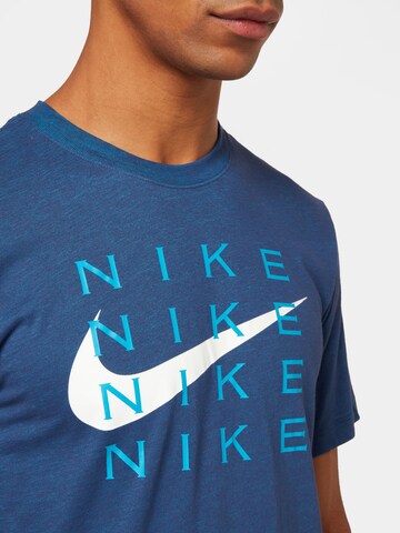 NIKE - Camiseta funcional en azul