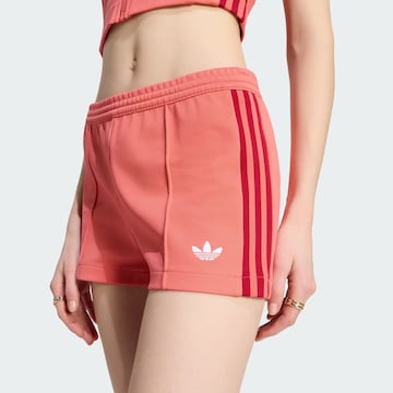 ADIDAS ORIGINALS Slim fit Trousers in Red