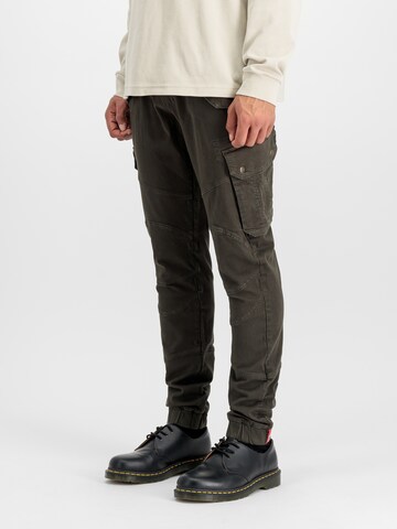 ALPHA INDUSTRIES Tapered Cargo trousers 'Combat' in Brown