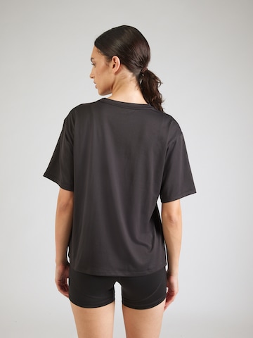 PUMA Funktionstopp 'TAD ESSENTIAL' i svart