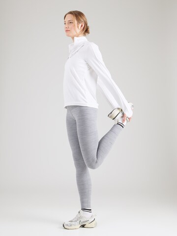 Skinny Pantaloni sportivi 'ONE' di NIKE in grigio