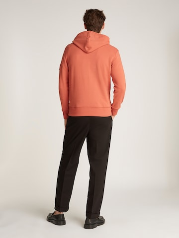 Felpa di Calvin Klein Jeans in arancione