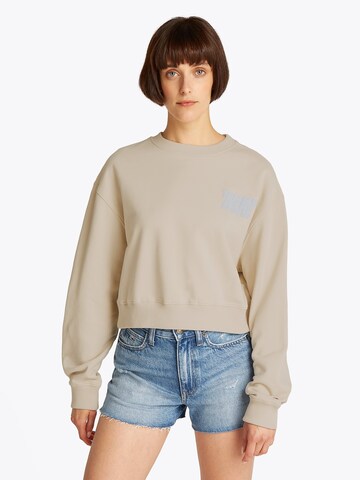 Tommy Jeans Μπλούζα φούτερ σε μπεζ: μπροστά