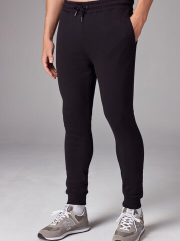 Skinny Pantalon Next en noir : devant