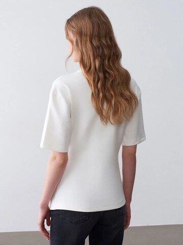Maglietta di Dilvin in bianco