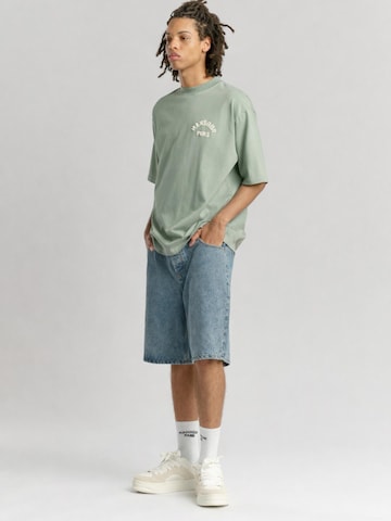 Mansour Bluser & t-shirts 'Paris College' i grøn