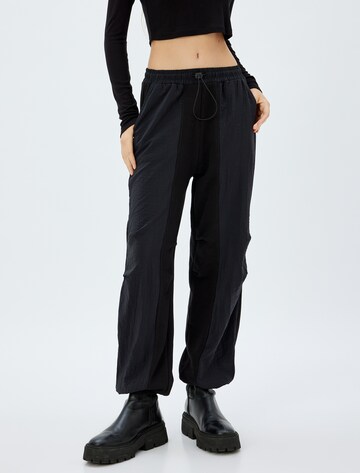 Koton Tapered Pants in Black: front