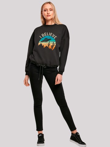 Sweat-shirt 'I Believe UFO Alien Sonnenuntergang' F4NT4STIC en noir