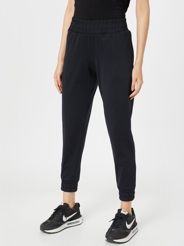 UNDER ARMOUR - Tapered Pantalón deportivo 'Meridian' en negro: frente