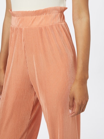 ABOUT YOU Limited Loose fit Pants 'Libby' in Orange