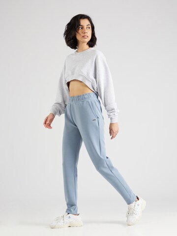 Athlecia Tapered Sporthose in Blau