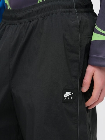 Nike Sportswear - Loosefit Pantalón 'AIR' en negro
