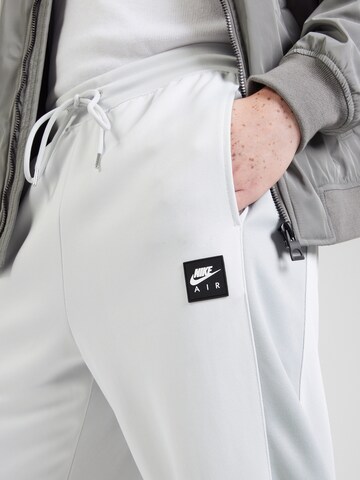 Nike Sportswear Normální Kalhoty 'AIR' – šedá