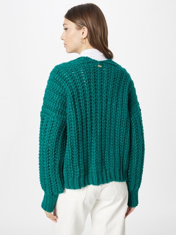 Geacă tricotată de la POM Amsterdam pe verde