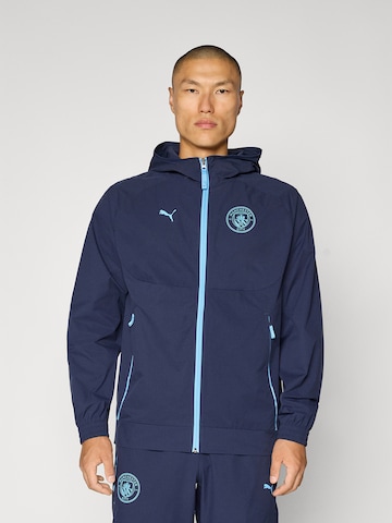 Veste de sport 'MCFC' PUMA en bleu : devant
