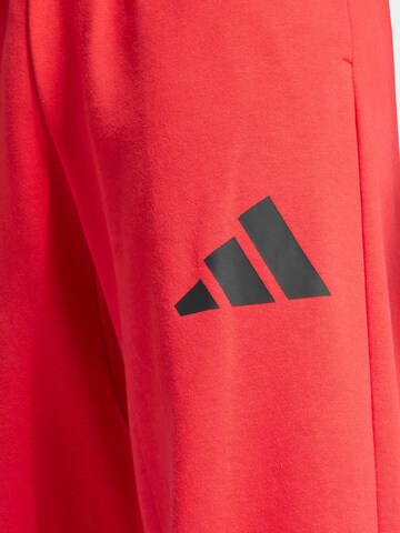 Loosefit Pantalon de sport 'Essentials' ADIDAS SPORTSWEAR en rouge