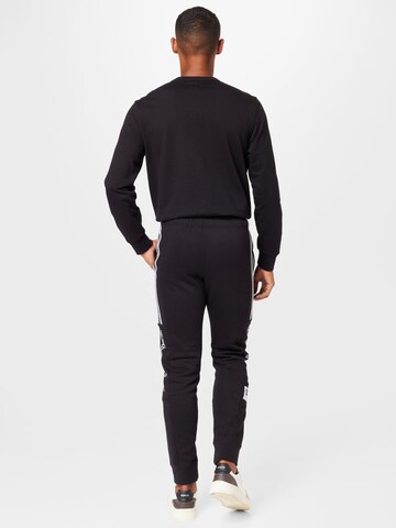 Champion Authentic Athletic Apparel Tapered Pants in Black