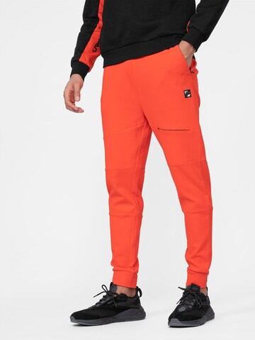 4F Tapered Workout Pants in Orange: front