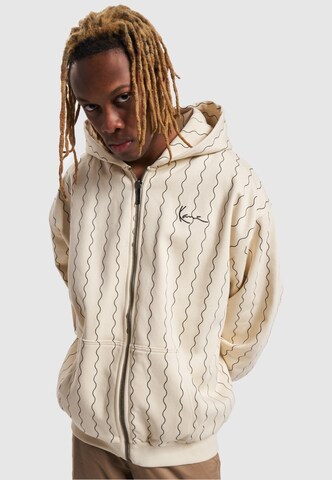 Veste de survêtement Karl Kani en beige : devant