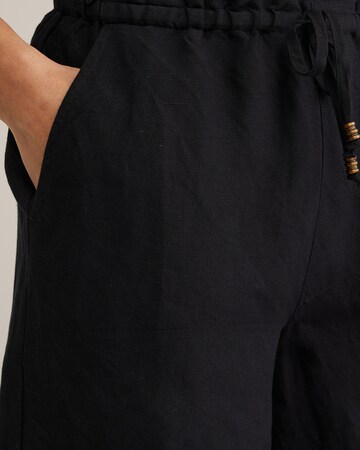 WE Fashion Loosefit Παντελόνι σε μαύρο