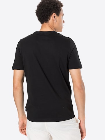 PUMA - Camiseta funcional 'Essentials' en negro