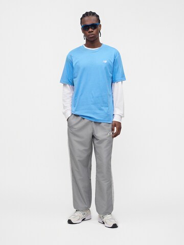 new balance Shirt 'Essential' in Blauw