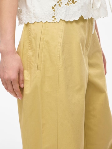 Wide leg Pantaloni di ROUGE EDIT in giallo