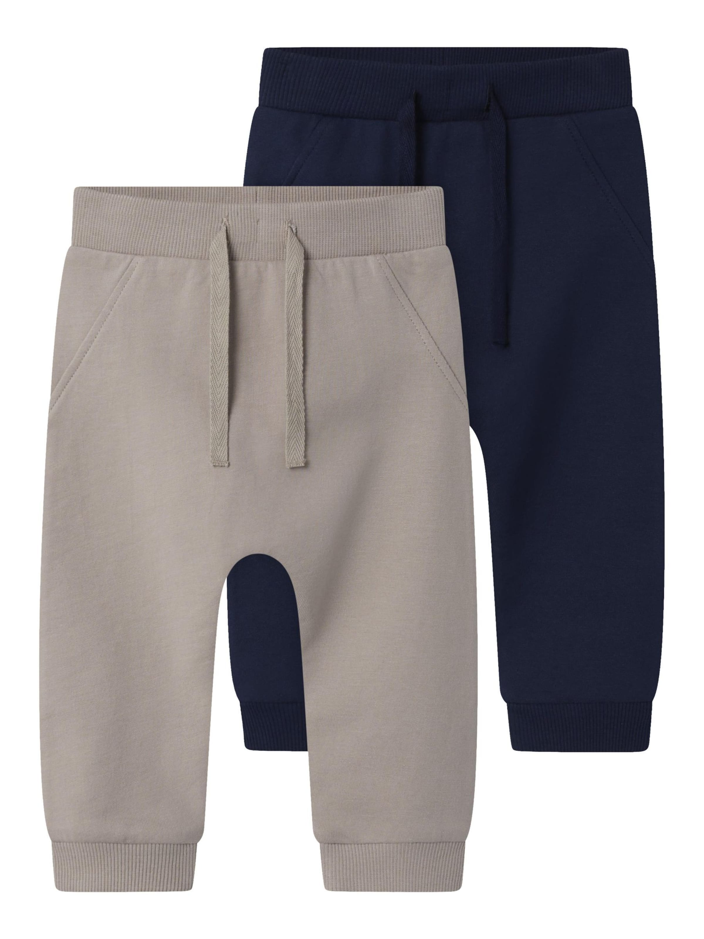 TWO SOON Tapered Trousers in Blue: front