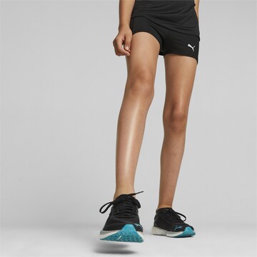 PUMA Skinny Leggings in Black: front