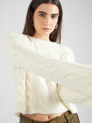 Pull-over Sisley en beige