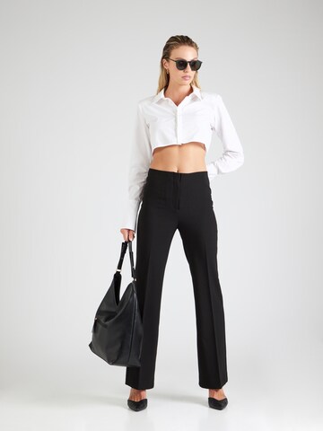 SOAKED IN LUXURY Flared Trousers with creases 'Corinne' in Black