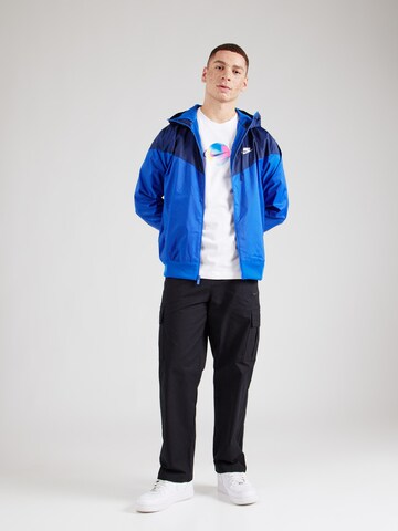 Nike SportswearPrijelazna jakna - plava boja