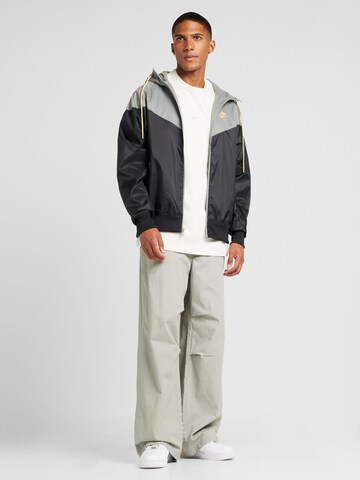 Nike SportswearPrijelazna jakna 'HERITAGE' - crna boja