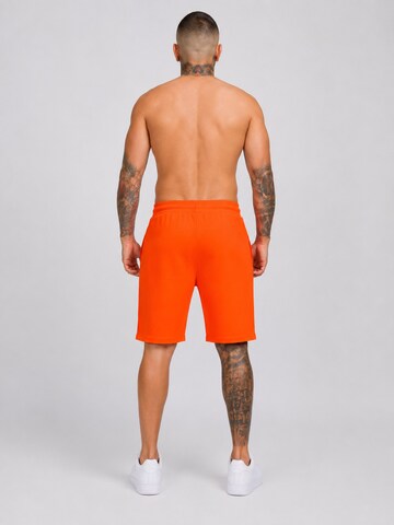 Boxeur des Rues - regular Pantalón deportivo 'Herren Baumwollshorts Boxeur des Rues, Orange, Schwarzes Logo' en naranja