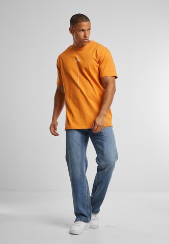 Merchcode Shirt 'Think Different' in Oranje