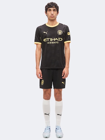 PUMA Loosefit Urheiluhousut 'MCFC' värissä musta