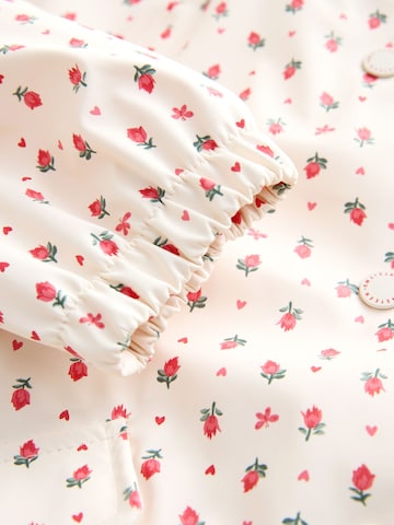 Palton de la Next pe bej