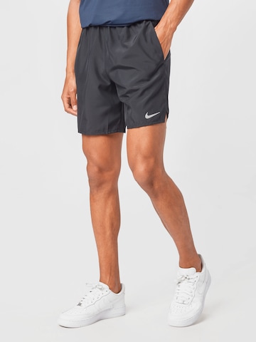 NIKE Regular Sports trousers in Black: front